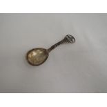 A Danish silver caddy spoon having moulded decoration to stem and pierced decoration to terminal,