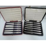 Two cased sets of HM silver handled butter knives having moulded decoration to handles