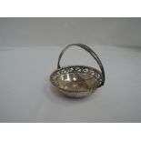 A small silver basket having pierced decoration and beaded handle, Birmingham 1921, makers marks