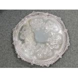 A large Victorian silver circular tray having engraved decoration, plain cartouche, moulded bead and