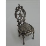 A small Victorian silver salon chair having embossed cherubic decoration, London 1897, Edward