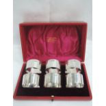 A cased set of six Edwardian silver napkin rings of plain form, Sheffield 1904, Thomas Bradbury &