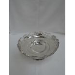 A silver bowl having pierced and shaped decoration to rim and circular pedestal foot with moulded