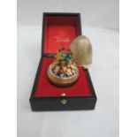 A Stuart Devlin silver gilt surprise egg for year 1976, Limited edition no 170, containing four