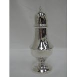 A silver caster of stepped baluster form having a pierced lid, Birmingham 1975 Lanson & Co