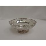 A small silver bowl having pierced decoration and moulded indented rim and facetted bowl, Birmingham