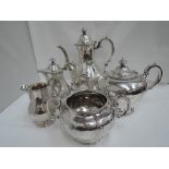 A five piece Victorian silver tea set consisting of teapot, coffee pot, hot water pot, cream jug and