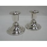 A pair of silver candlesticks of plain squat form, Birmingham 1981, W I Broadway & Co