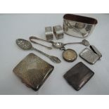 A small selection of HM silver and white metal including card holder, vesta, cigarette case, spoons,