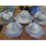 A vintage china tea service in blue white and gilt