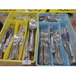 A selection of cutlery, in vintage plastic drawer trays