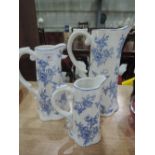 A set of 3 reproduction Victorian style graduated blue and white jugs