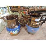 Three lustre jugs with applique decoration(one A/F)