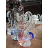 A collection of glass swans