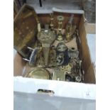 A box of brass ware including candlesticks, bellows etc