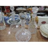 Three cut glass decanters