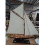 A treen model yacht with rigging