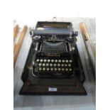 A vintage Corona fold over boxed typewriter with instruction book