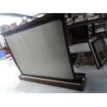 A vintage projector screen in treen box