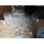 Five crystal wine glasses and four brandy balloons