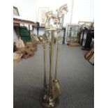 A brass companion stand with horse decoration