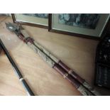 Two spears with metal points, wooden shafts, covered in leather and skin, also knife in scabbard,