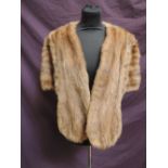 A light brown mink fur evening cape