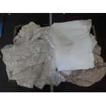 A selection of linen including lace edged table cloths, pillowcases, lace cloths etc