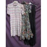 Three vintage lady's dresses including a floral summer voile dress on black ground with underskirt