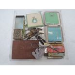 A small selection of misc items including enamelled compacts by Stratton, hair clips, notepad with