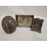 Three small HM silver photograph frames of various forms