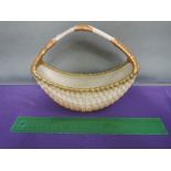 A Royal Worcester bowl of woven basket form having blush ivory ground, numbered 2526