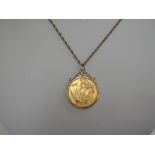 A gold sovereign dated 1974 in a 9ct gold mount on a 9ct gold chain