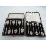 A cased set of HM silver coffee spoons of plain form and a cased set of HM silver tea spoons
