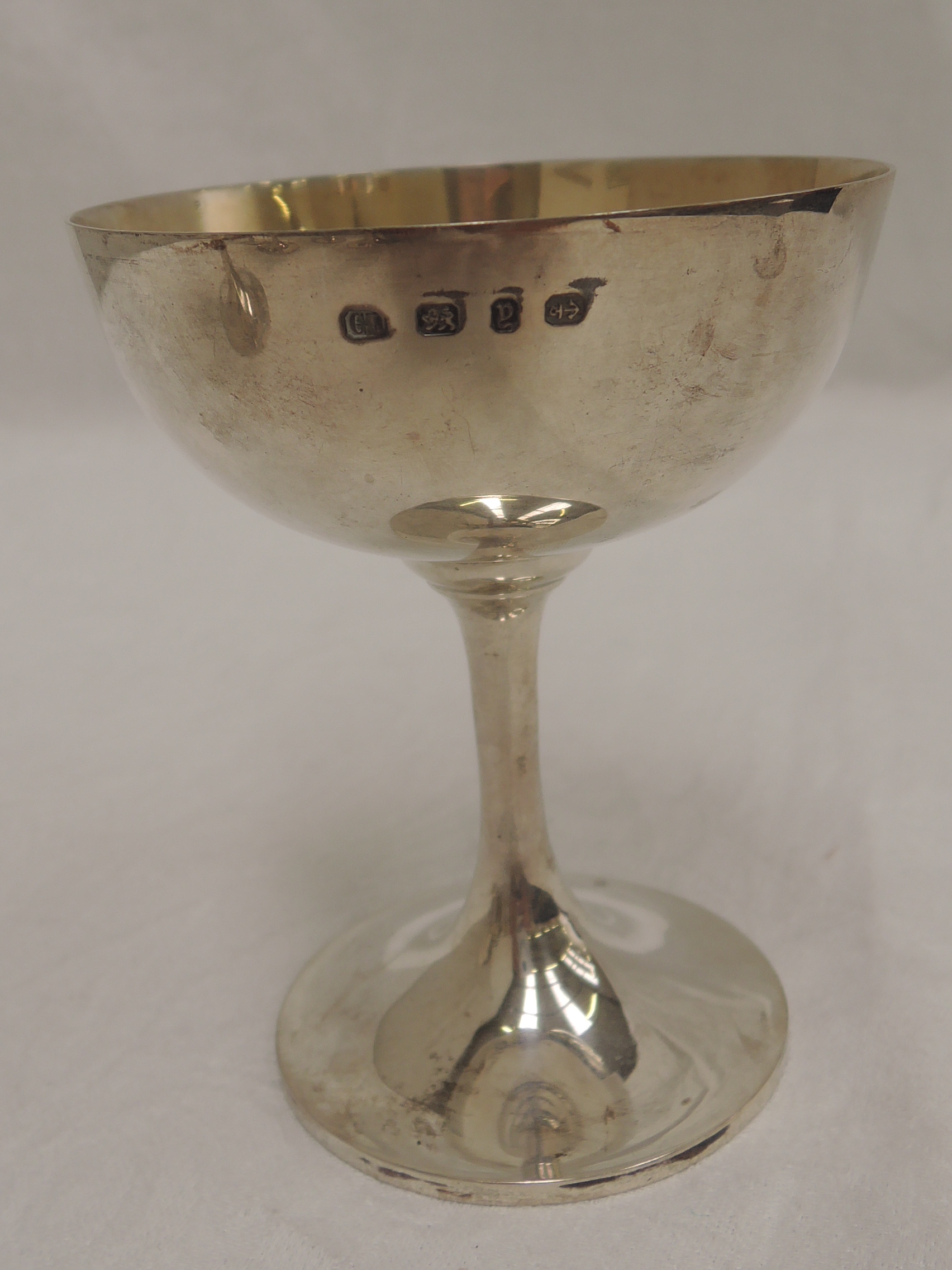 A set of six Victorian silver champagne coupes of plain form having gilt bowls, Birmingham 1898, - Image 2 of 2