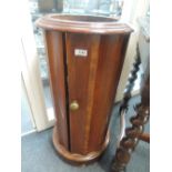 A 19th century mahogany cylindrical commode base of fluted design originally from Wray Castle on