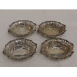 A set of four Victorian silver trinket dishes of oval form having pierced and moulded decoration,
