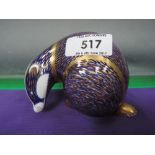 A Royal Crown Derby paperweight modelled as badger, gold stopper