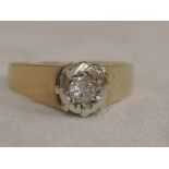 A lady's diamond solitaire dress ring, approx .125ct in an illusionary setting to raised shoulders