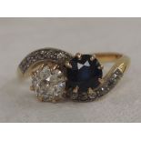 A lady's dress ring having a sapphire and diamond, approx 0.5ct each in a twist setting to diamond