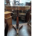 An early 19th century Regency design rosewood pedestal table having circular top with 20th century