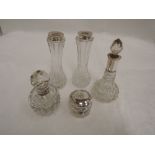 Five cut glass dressing table pots including perfume bottles, all having HM silver collars