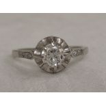 A lady's dress ring having a diamond solitaire, approx .45ct in a frilled claw mount with diamond