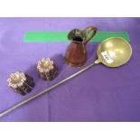 A Georgian design brass and iron handle ladle and a pair of miniature 19th century jelly moulds