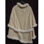 A vintage double layer cape having marabou down trim and embroidered decoration