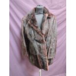 A dark brown mink fur 3/4 length coat having lapel collar