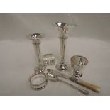 A small selection of HM silver including bud vases, mother of pearl handled butter knife, egg cup