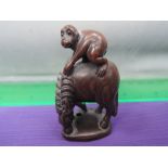 A treen netsuke modelled as monkey on horse