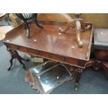 A mid Victorian mahogany washstand having raised lip back with three frieze drawers and fluted