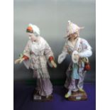 A pair of Meissen style figures modelled as 19th century Oriental couple in traditional dress,